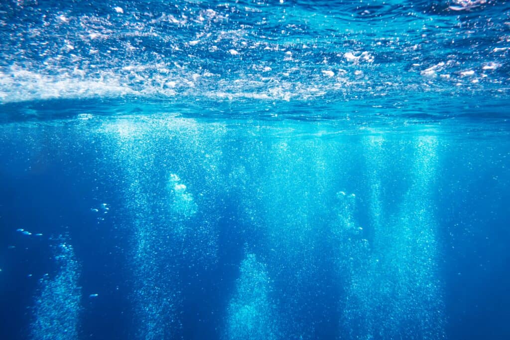 Abstract underwater background with air bubbles, dominica