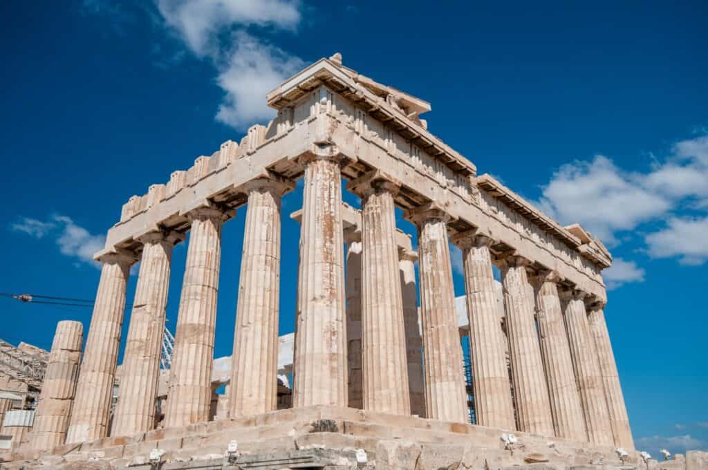 Ancient temple of parthenon with symmetrical columns at acropolis hill in Athens, Greece, most iconic landmarks in the world