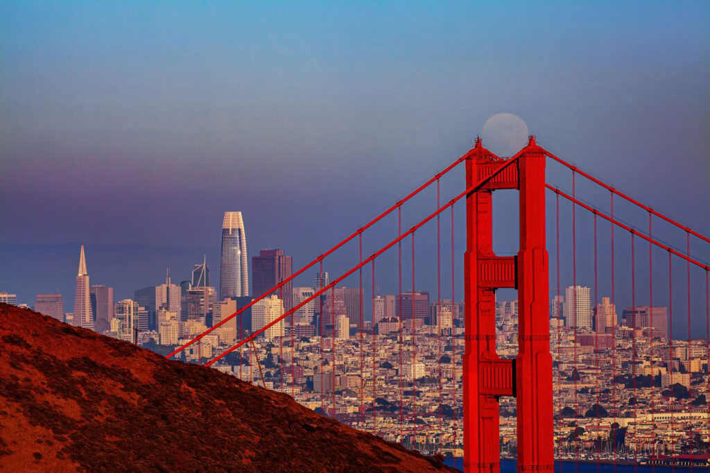 Part of the Golden Gate Bridge with a cityscape in the background, San Francisco, USA, best places to visit in the usa