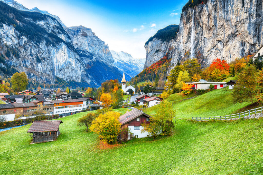 Amazing autumn landscape of touristic alpine village Lauterbrunnen, best places to visit in Switzerland