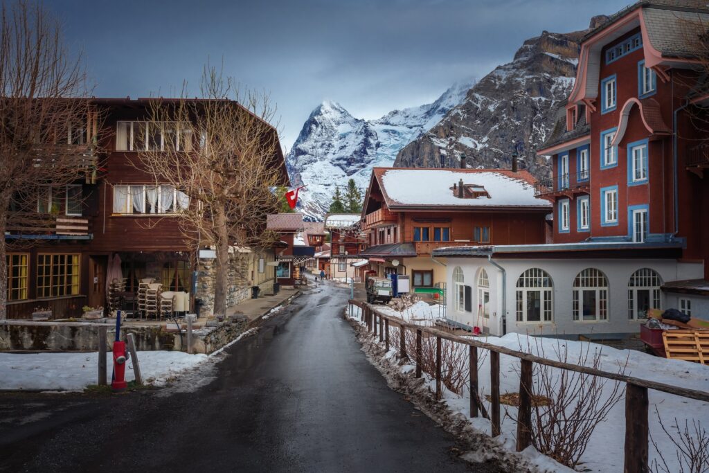 Street and buildings in Murren Village with Eiger Mountain on background - Murren, Switzerland, best places to visit in Switzerland