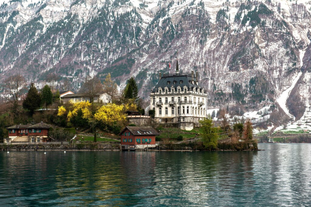 View over Lake Brienz to castle Seeburg,Iseltwald, best places to visit in switzerland