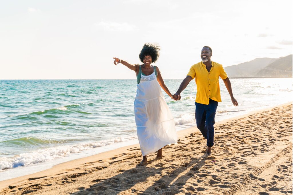 Couple running on the beach in Maui, Hawaii