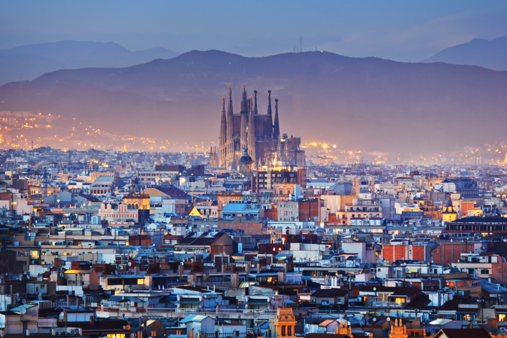 City of Barcelona, Spain, with mountain in the background and the Sagrada Familia in the center. Barcelona  is one of the most vegan-friendly cities in the world.