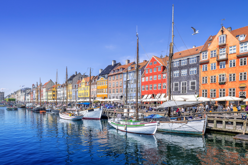 Colorful buildings and boats lined up on the river in Copenhagen, Denmark