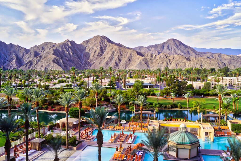 Beautiful resort with mountains in the background, seen during the best time to visit Palm Springs.